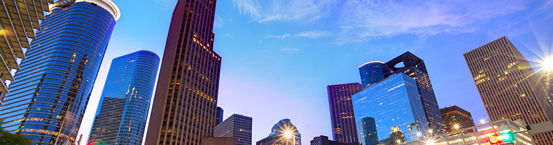 A city intersection from the point-of-view of a pedestrian.